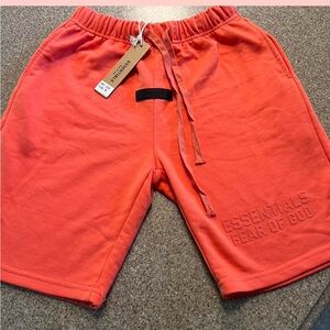 Brand New Coral size small Men’s Essentials Shorts.